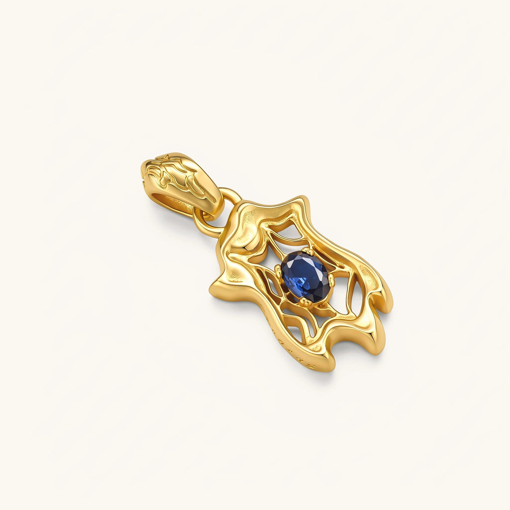 Gold-plated 925 silver spider web pendant with oval blue sapphire stone on a box chain, 37mm long.