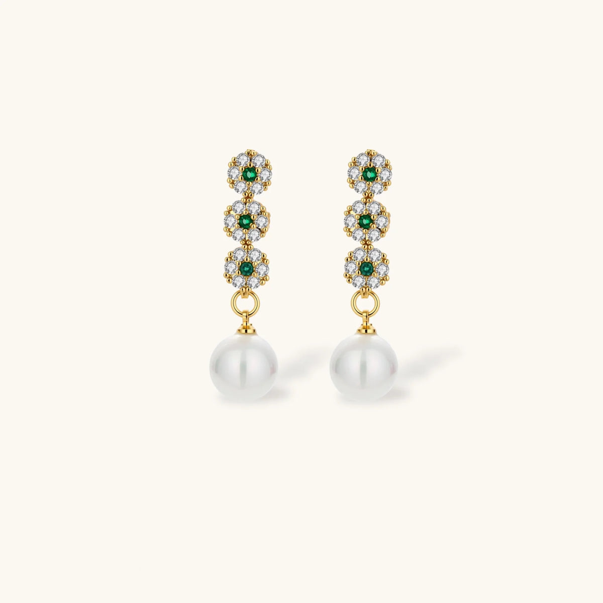 Gold plated necklace with green and clear zirconia flower clusters and matching drop earrings with white round beads.
