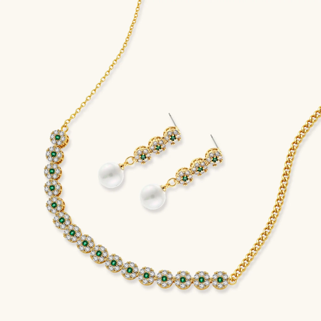 Gold plated necklace with green and clear zirconia flower clusters and matching drop earrings with white round beads.