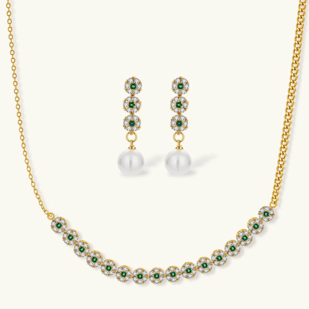 Gold plated necklace with green and clear zirconia flower clusters and matching drop earrings with white round beads.