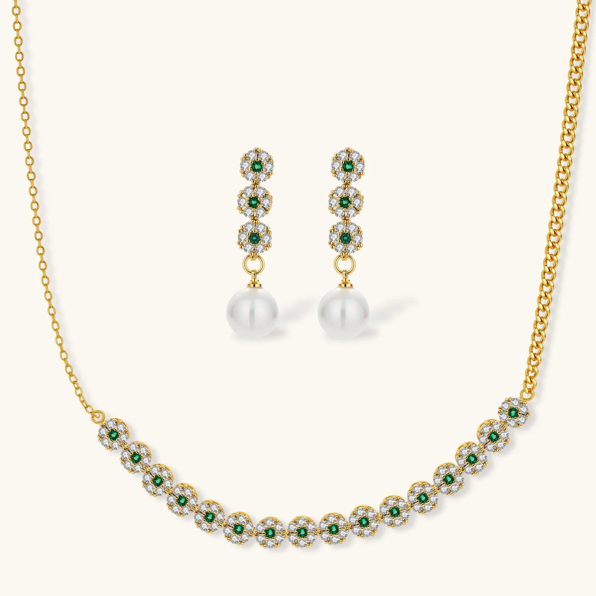 Gold plated necklace with green and clear zirconia flower clusters and matching drop earrings with white round beads.