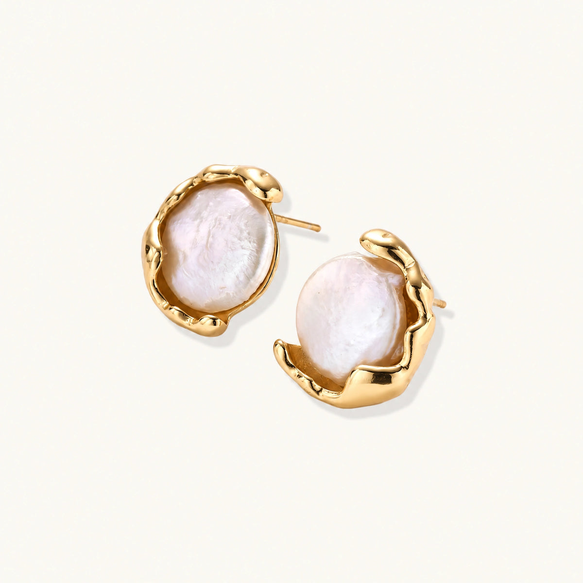 Gold vermeil studs with lustrous pink freshwater pearls in organic crescent settings