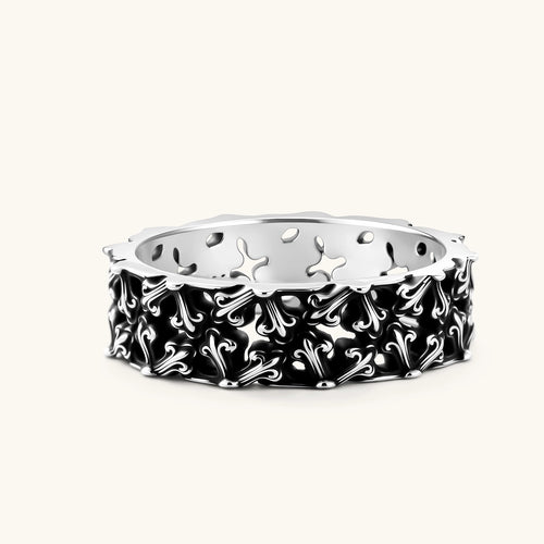 Sterling silver band ring with oxidized black fleur-de-lis cutwork pattern, 6.5mm wide, on white background.