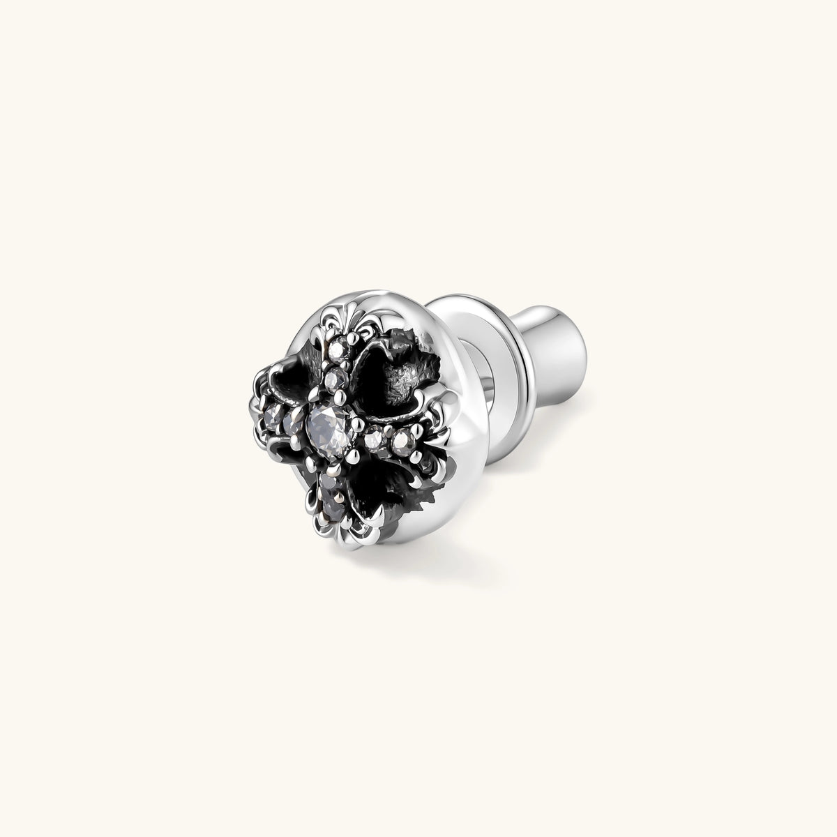 Sterling silver dome stud earring with oxidized black petals, ornate scrollwork, and clear cubic zirconia stones, butterfly back.