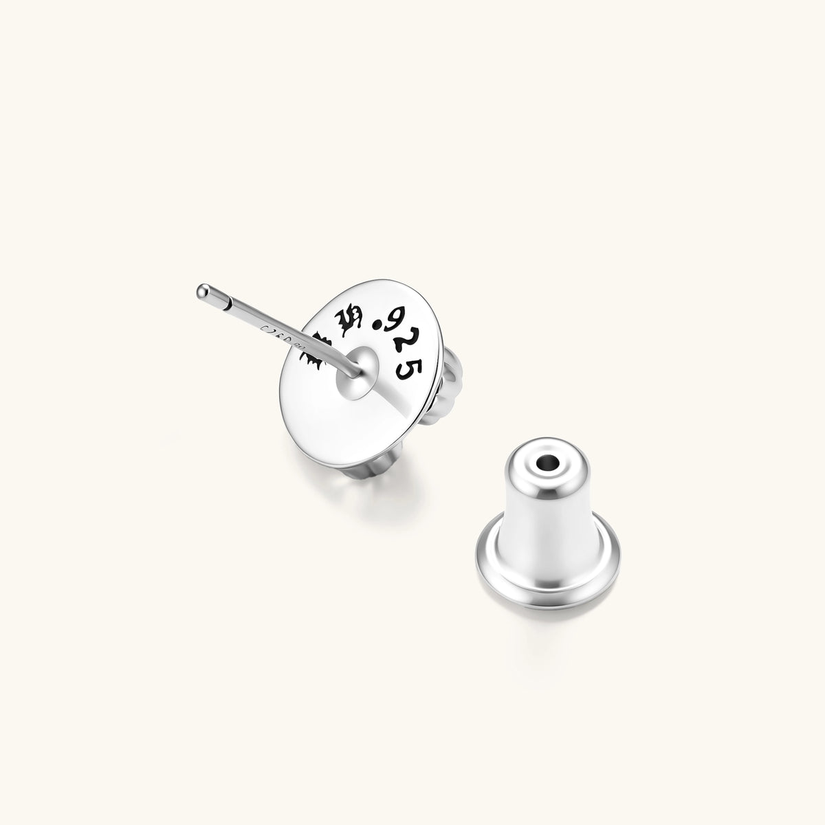 Sterling silver dome stud earring with oxidized black petals, ornate scrollwork, and clear cubic zirconia stones, butterfly back.